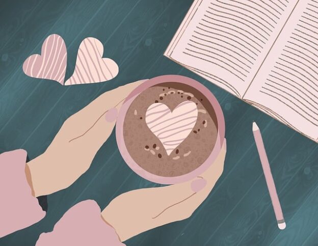 Cartoon of hands holding a full coffee cup with heart-shaped froth on top next to a book laying open